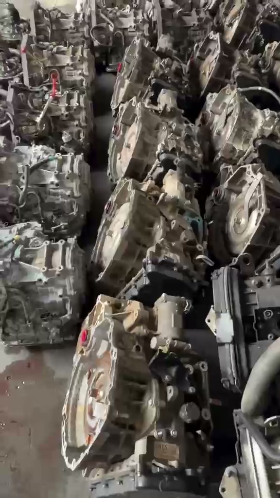 Rows of used automatic transmissions lined up on the warehouse floor
